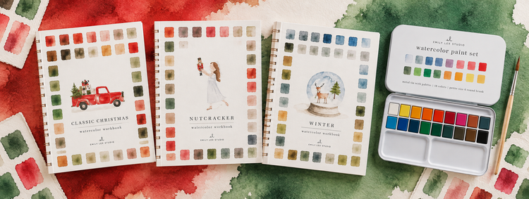 Classic Christmas, Nutcracker and Winter watercolor workbooks alongside an Emily Lex paint set on a red and green watercolor background