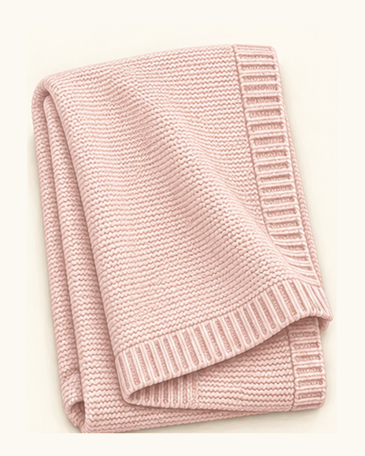 Illustration of the blush cotton knit baby blanket with ribbed edging