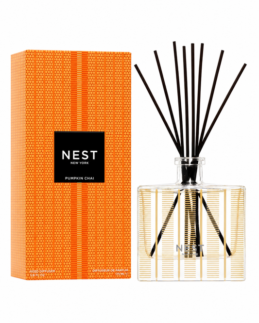 NEST Pumpkin Chai Reed Diffuser with orange gift box on a white background